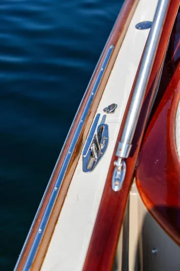 Fiveadrift Yacht Photos Pics Close-up of 2003 Hinckley Talaria 29R boat railing and cleat on water.