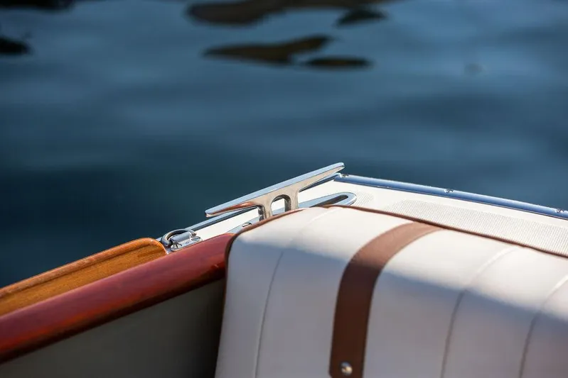 Fiveadrift Yacht Photos Pics 2003 Hinckley Talaria 29R boat detail with leather seating and polished cleat.