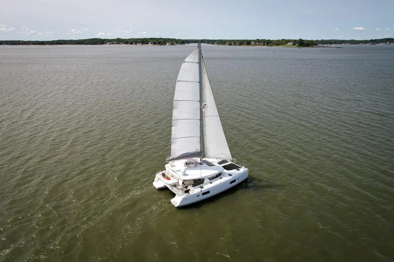 Reunited Yacht Photos Pics Sailing Lagoon 42 catamaran from 2017 gliding on open water.