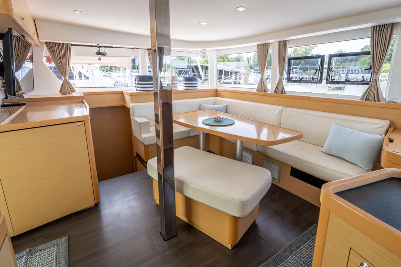 Reunited Yacht Photos Pics Interior of 2017 Lagoon 42 catamaran with spacious seating and modern design.