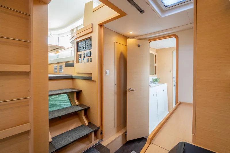 Reunited Yacht Photos Pics Interior of 2017 Lagoon 42 catamaran, featuring modern design and wooden finishes.