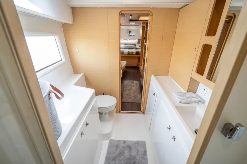 Reunited Yacht Photos Pics Luxurious bathroom interior of 2017 Lagoon 42 catamaran, featuring modern fixtures and ample natural light.