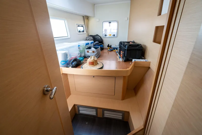 Reunited Yacht Photos Pics Interior of 2017 Lagoon 42 yacht with wooden cabinetry and storage space.