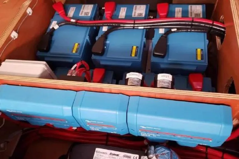 Reunited Yacht Photos Pics Electrical system components in a 2017 Lagoon 42 catamaran, featuring blue power units.