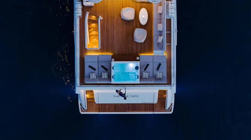  Yacht Photos Pics Luxurious Azimut Grande 32 Metri yacht deck at night, featuring elegant seating and ambient lighting.