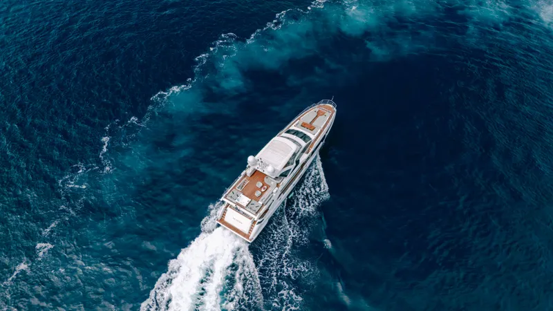  Yacht Photos Pics Aerial view of 2020 Azimut Grande 32 Metri yacht cruising in deep blue ocean.