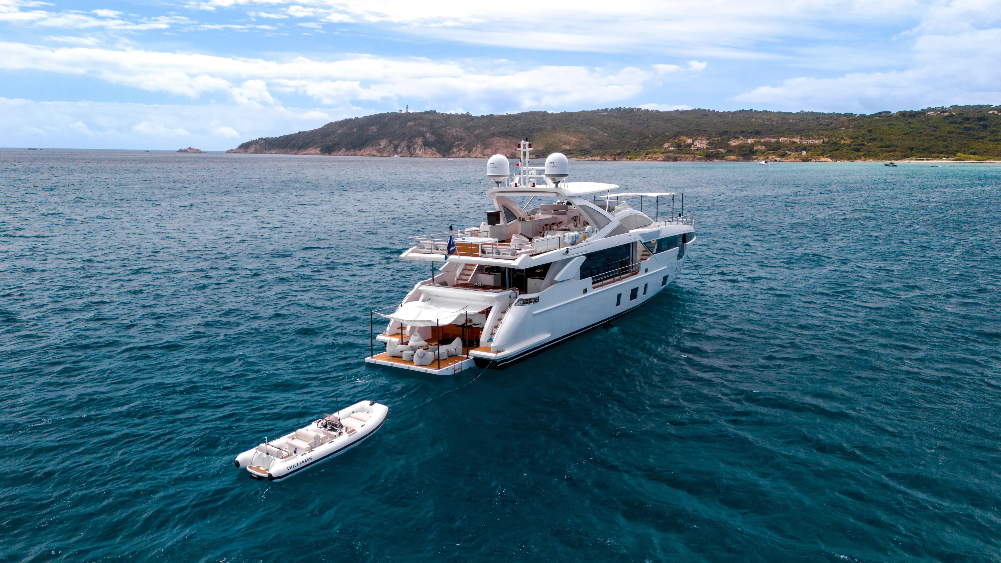  Yacht Photos Pics Luxurious 2020 Azimut Grande 32 Metri yacht anchored in scenic coastal waters.