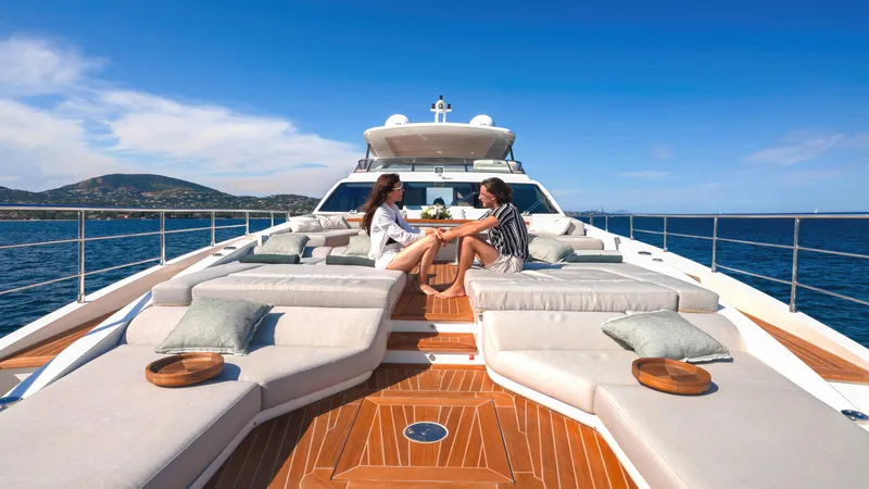 Yacht Photos Pics Two people relaxing on the deck of a 2020 Azimut Grande 32 Metri yacht.