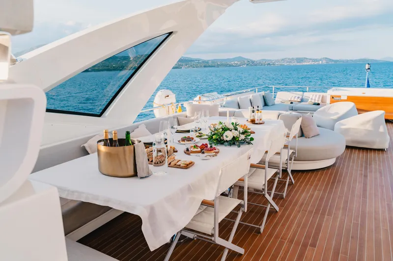  Yacht Photos Pics Luxurious dining setup on 2020 Azimut Grande 32 Metri yacht with ocean view.
