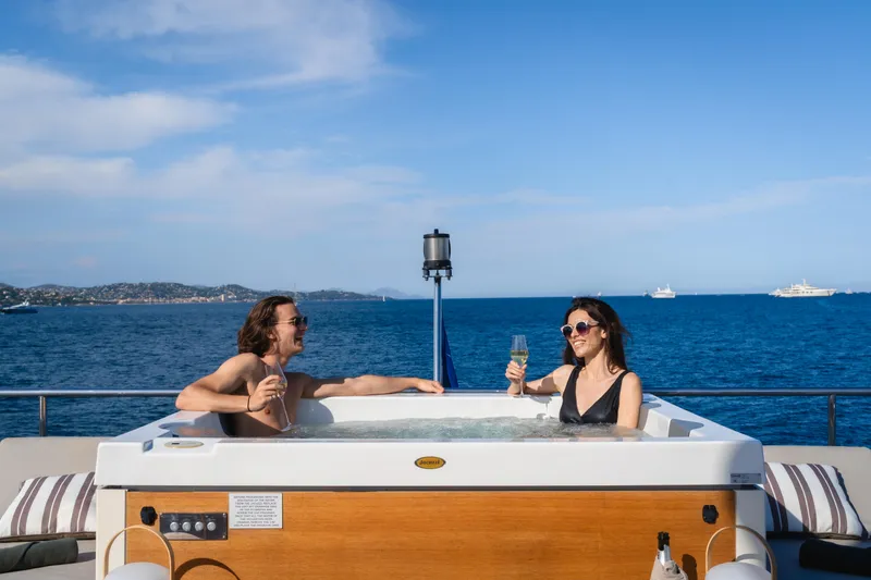  Yacht Photos Pics Couple enjoying a jacuzzi on Azimut Grande 32 Metri yacht, 2020, with ocean view.