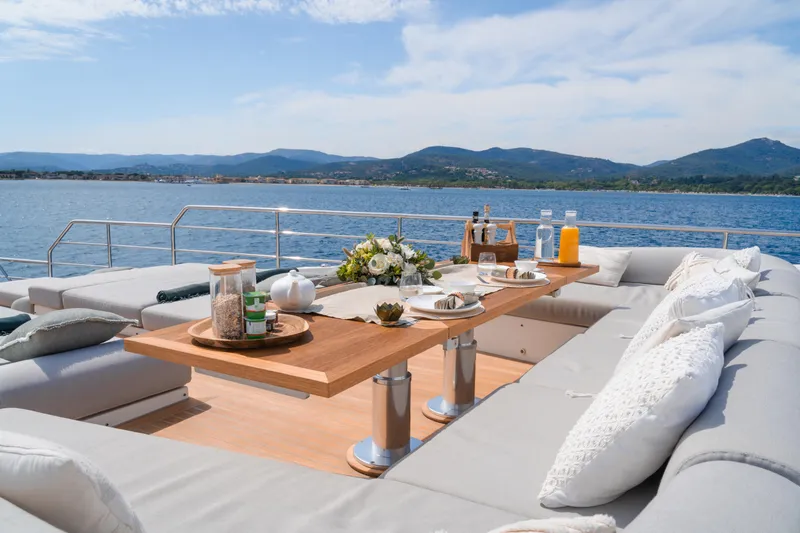  Yacht Photos Pics Luxurious deck of 2020 Azimut Grande 32 Metri yacht with elegant dining setup.