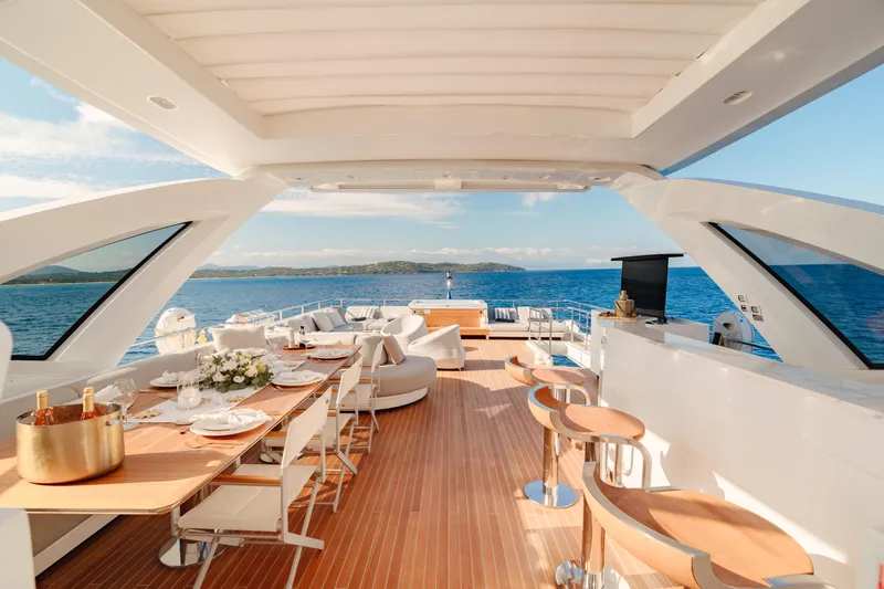  Yacht Photos Pics Luxurious Azimut Grande 32 Metri yacht deck with elegant dining area, 2020 model.