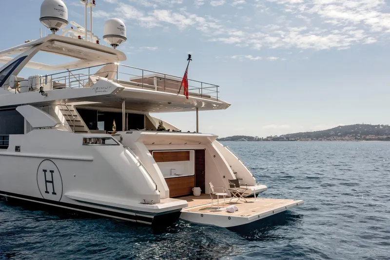 Yacht Photos Pics Luxury Azimut Grande 32 Metri yacht, 2020 model, anchored in serene blue waters.