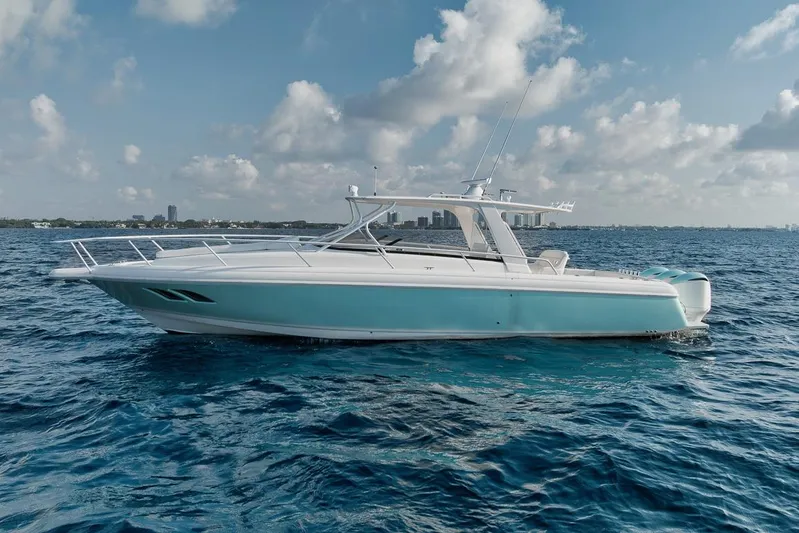  Yacht Photos Pics 2008 Intrepid 390 Sport Yacht cruising on open ocean under cloudy sky.