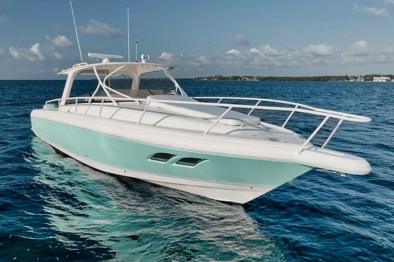  Yacht Photos Pics 2008 Intrepid 390 Sport Yacht cruising on clear blue ocean waters.