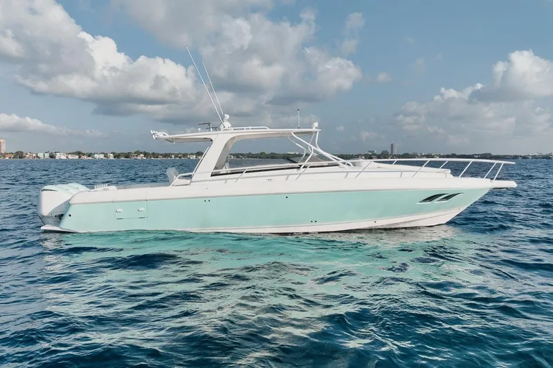  Yacht Photos Pics 2008 Intrepid 390 Sport Yacht on open water under a partly cloudy sky.