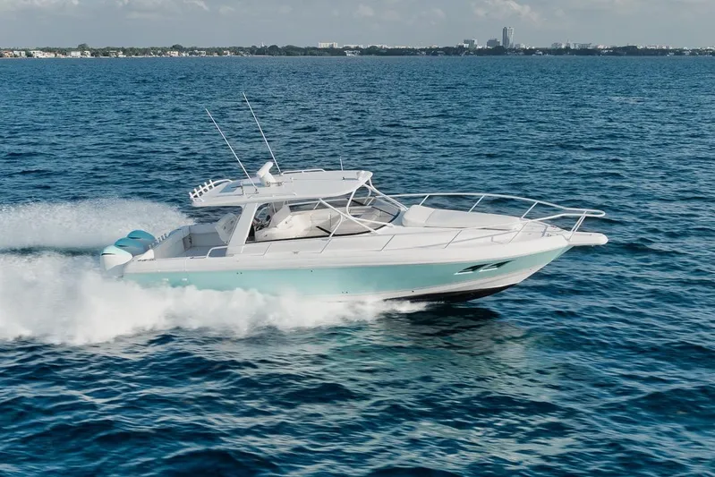  Yacht Photos Pics 2008 Intrepid 390 Sport Yacht cruising on open water, showcasing sleek design and performance.