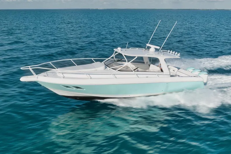  Yacht Photos Pics 2008 Intrepid 390 Sport Yacht cruising on clear blue ocean waters.