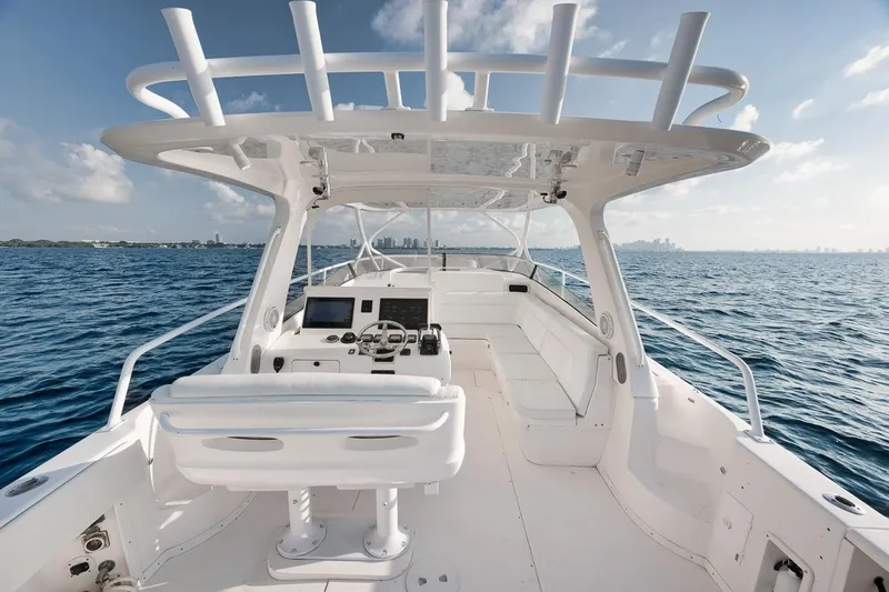  Yacht Photos Pics 2008 Intrepid 390 Sport Yacht on open water, featuring sleek white design and spacious deck.