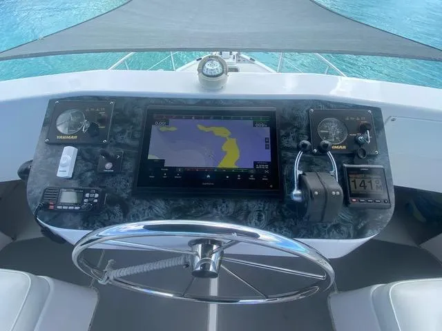 Korkzcrew Yacht Photos Pics Helm of 2008 Great Harbour N37 with navigation equipment and steering wheel.