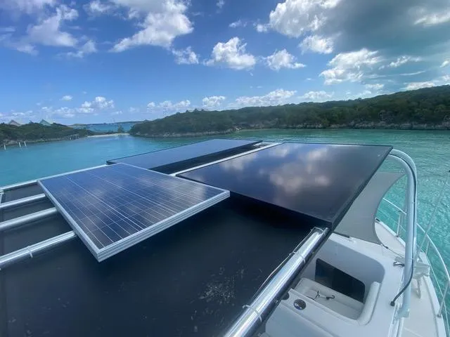 Korkzcrew Yacht Photos Pics Great Harbour N37 yacht with solar panels, 2008 model, cruising on clear blue waters.