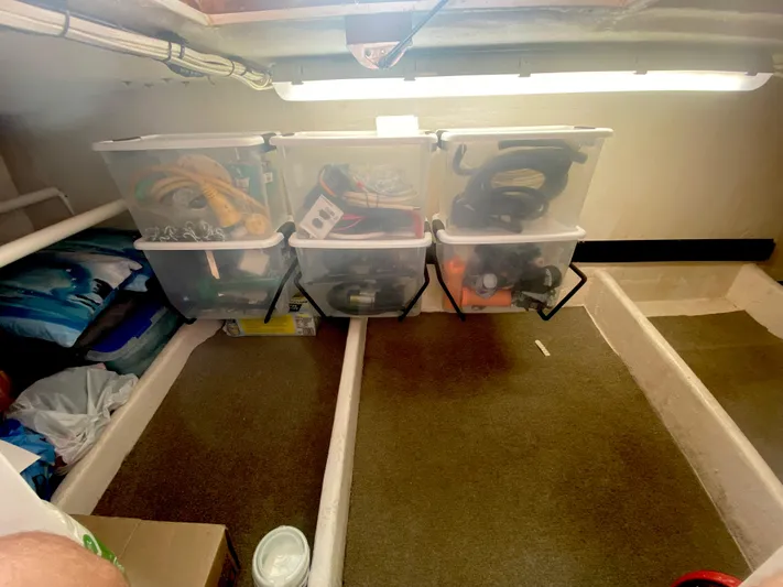Korkzcrew Yacht Photos Pics Storage area in a 2008 Great Harbour N37 boat with organized plastic bins.