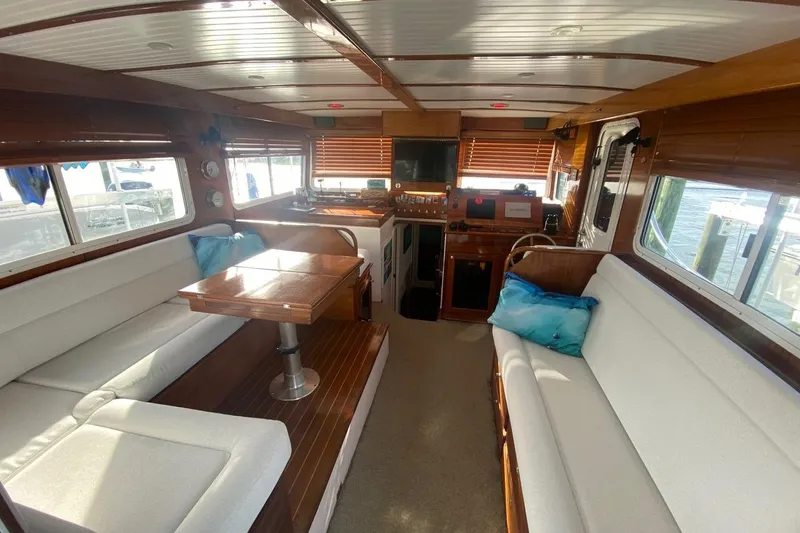 Korkzcrew Yacht Photos Pics Interior of 2008 Great Harbour N37 yacht with cozy seating and wooden accents.