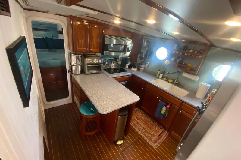 Korkzcrew Yacht Photos Pics 2008 Great Harbour N37 yacht kitchen with modern appliances and wooden cabinetry.