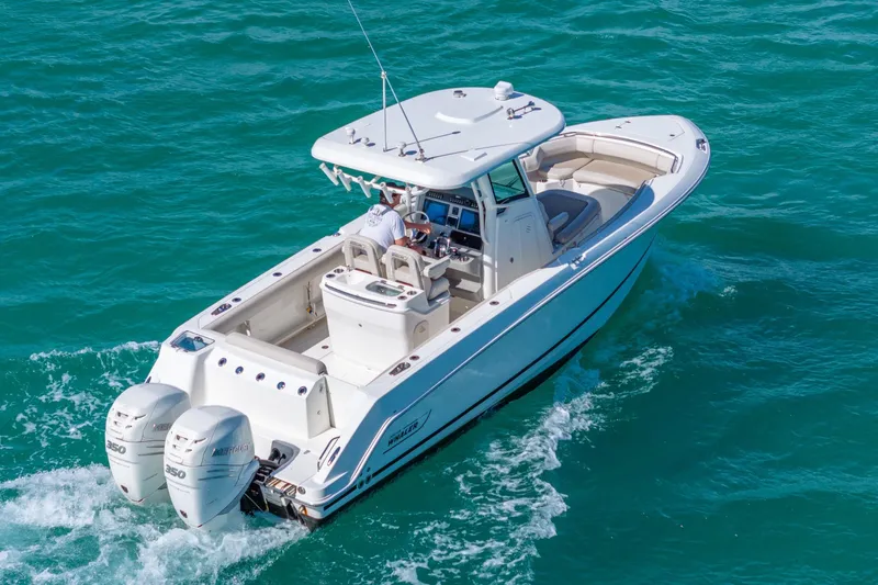  Yacht Photos Pics 2016 Boston Whaler 280 Outrage cruising on clear blue water.