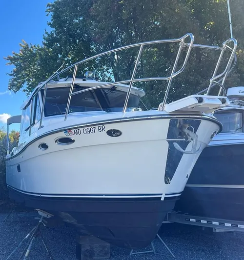  Yacht Photos Pics 2016 Cutwater C-28 boat on display, white hull, docked outdoors.