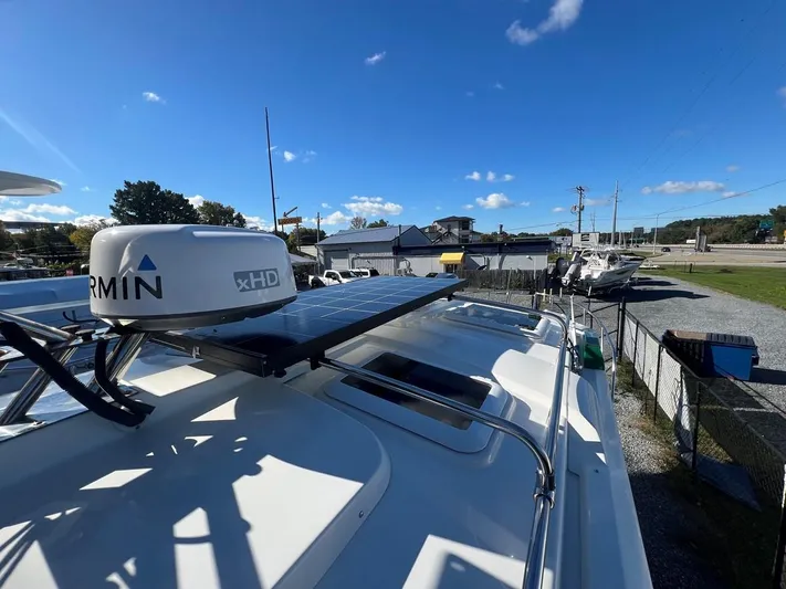  Yacht Photos Pics 2016 Cutwater C-28 boat with Garmin xHD radar and solar panel, docked under clear blue sky.