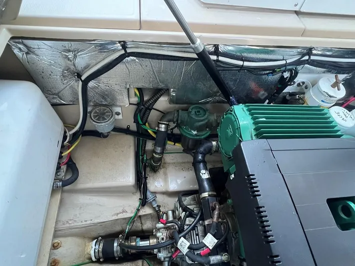  Yacht Photos Pics Engine compartment of a 2016 Cutwater C-28 boat, showcasing mechanical components and wiring.