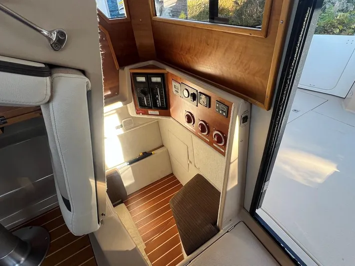  Yacht Photos Pics 2016 Cutwater C-28 boat interior with control panel and seating area.