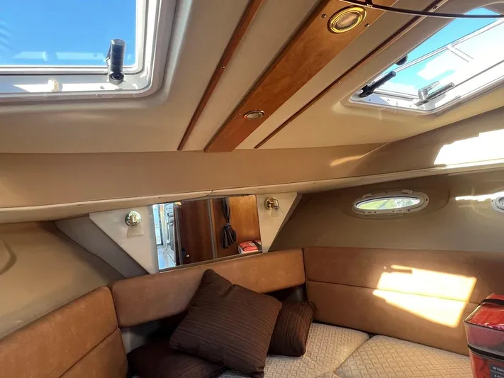  Yacht Photos Pics Interior of 2016 Cutwater C-28 boat with cozy seating and skylights.