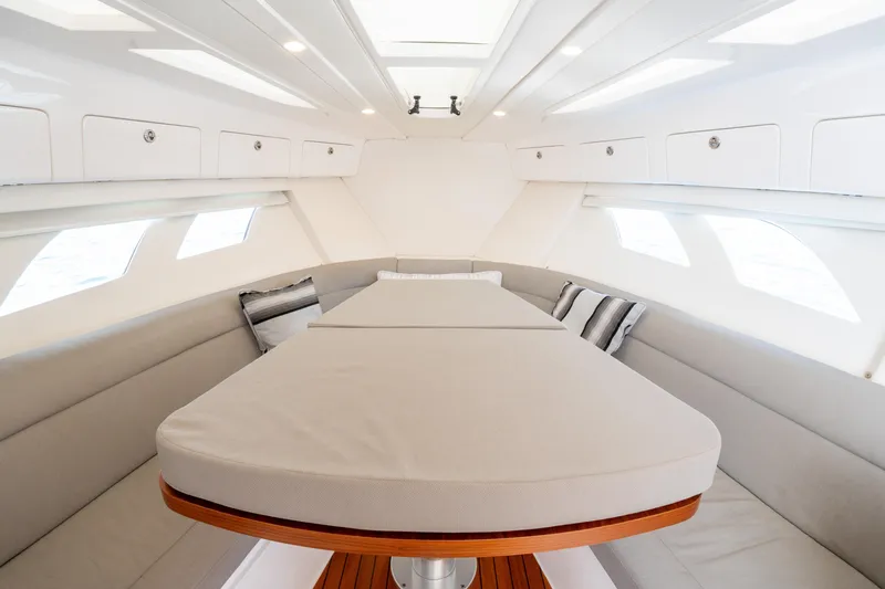 Yacht Photos Pics Interior of 2019 Intrepid 407 Cuddy, featuring a cozy seating area and modern design.