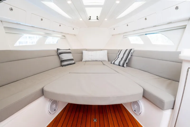  Yacht Photos Pics Luxurious interior of 2019 Intrepid 407 Cuddy boat with plush seating and elegant design.