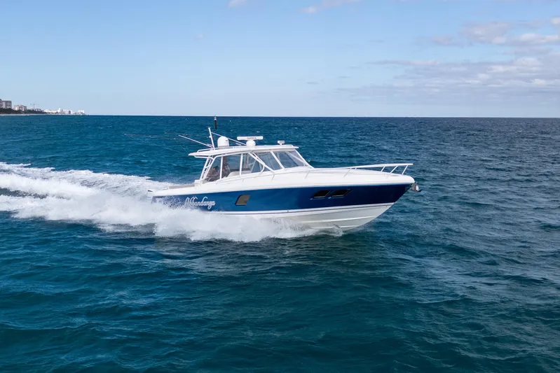  Yacht Photos Pics 2019 Intrepid 407 Cuddy cruising on open blue ocean waters.