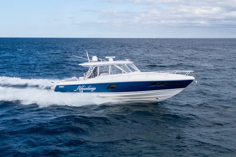  Yacht Photos Pics 2019 Intrepid 407 Cuddy cruising on open ocean waters.