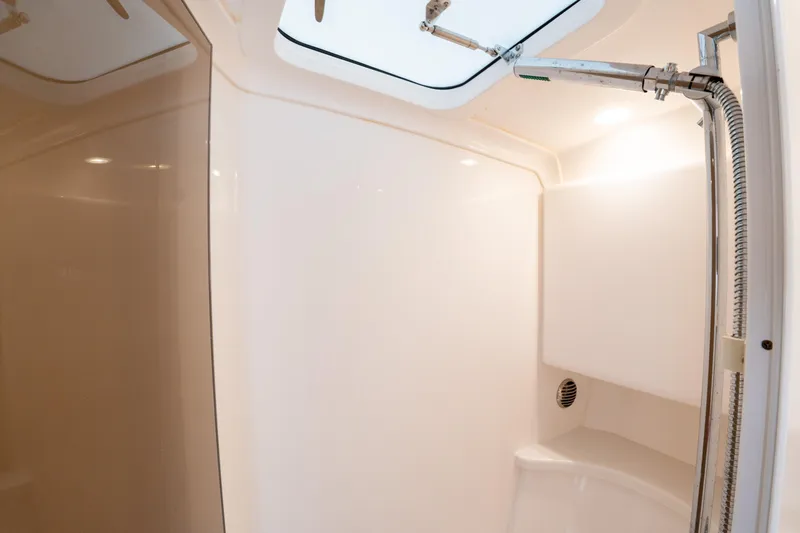 Yacht Photos Pics Interior of 2019 Intrepid 407 Cuddy boat, featuring a sleek, modern shower area.