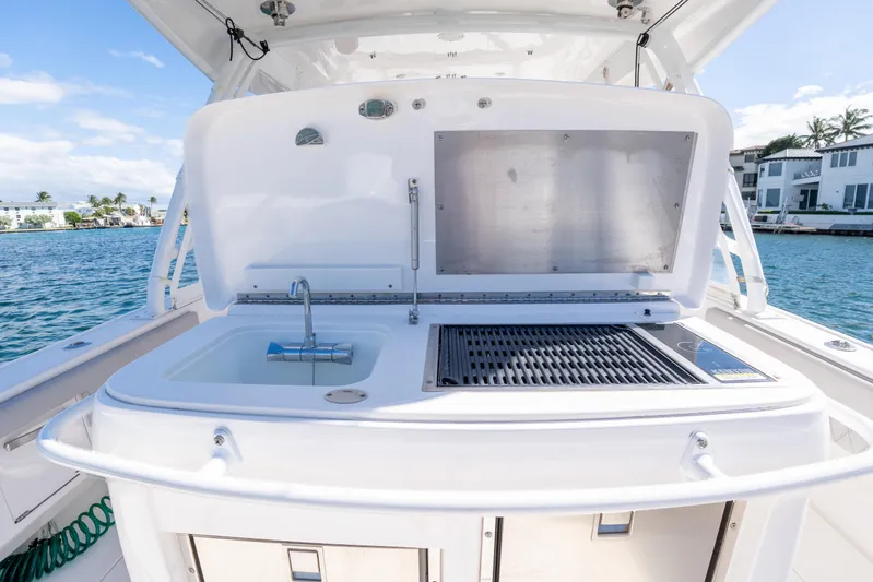  Yacht Photos Pics 2019 Intrepid 407 Cuddy boat with outdoor sink and grill setup.