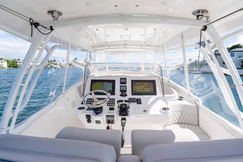  Yacht Photos Pics Cockpit view of 2019 Intrepid 407 Cuddy boat with modern navigation system.