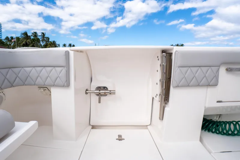  Yacht Photos Pics 2019 Intrepid 407 Cuddy boat interior with quilted seating and blue sky background.