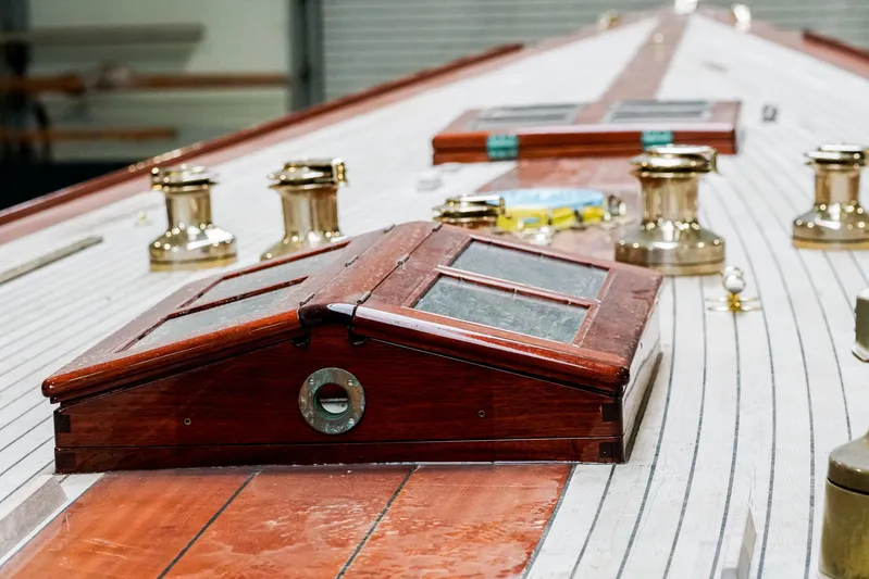 Wings K-15 Yacht Photos Pics Restored 1937 Classic 12-metre yacht deck with polished wood and brass fittings.