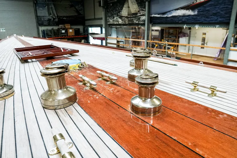 Wings K-15 Yacht Photos Pics Restored 1937 Classic 12-metre yacht deck with polished winches and wooden finish.