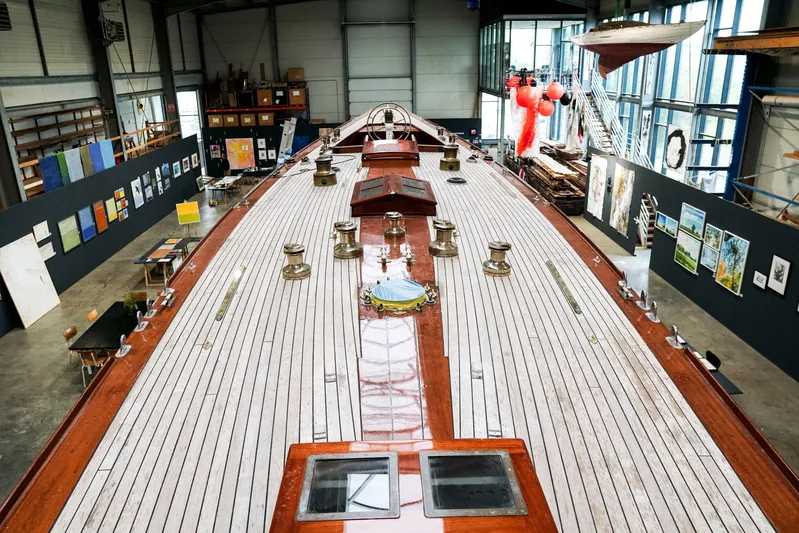 Wings K-15 Yacht Photos Pics Restored 1937 Classic 12-metre yacht in a modern exhibition space.