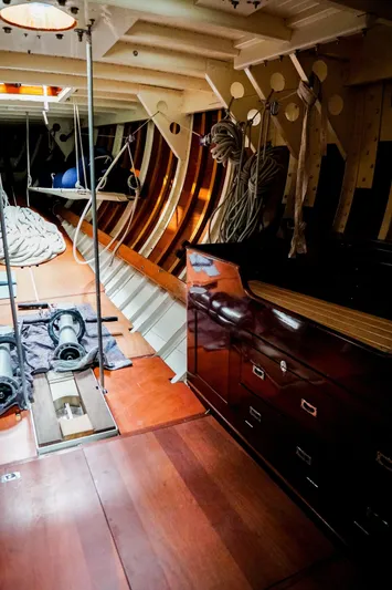 Wings K-15 Yacht Photos Pics Interior of a 1937 Classic 12-metre yacht with wooden finishes and nautical equipment.