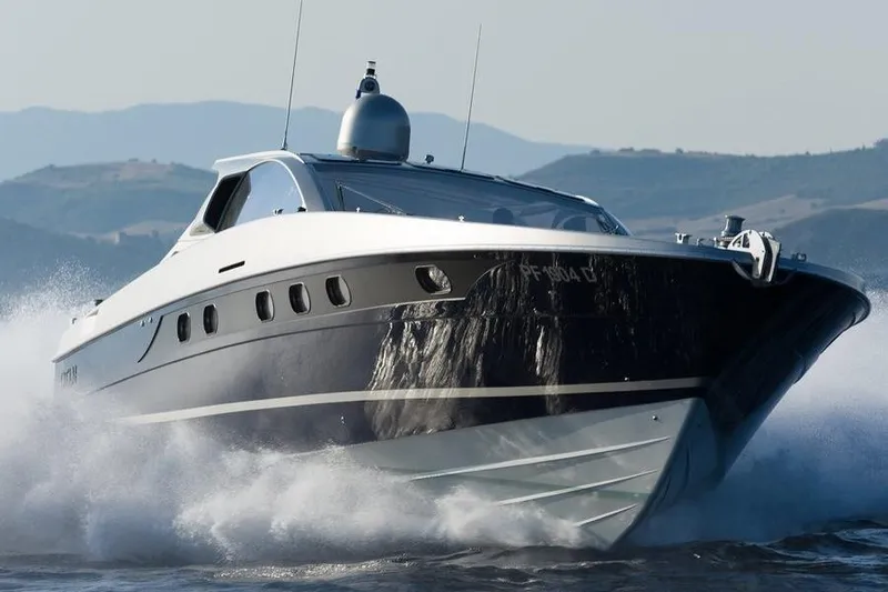 M/y Catch Me Yacht Photos Pics 2010 Otam 58 yacht cruising swiftly on open water.