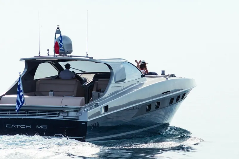 M/y Catch Me Yacht Photos Pics Luxury Otam 58 yacht cruising on calm waters, 2010 model.