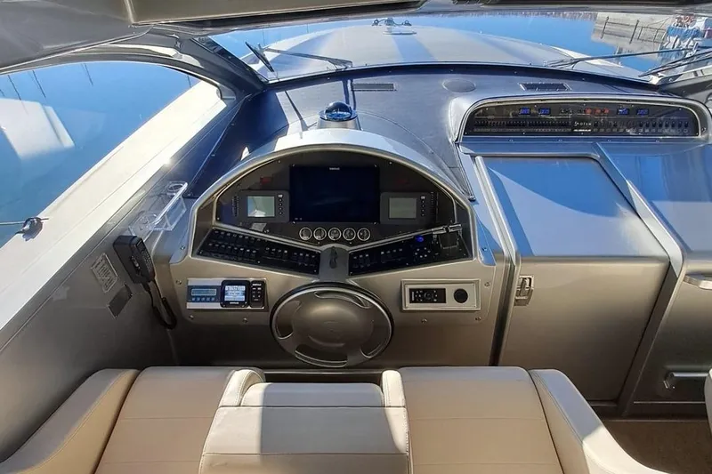 M/y Catch Me Yacht Photos Pics Cockpit of 2010 Otam 58 yacht with modern navigation controls and leather seating.