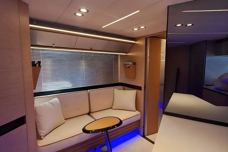 M/y Catch Me Yacht Photos Pics Luxurious interior of a 2010 Otam 58 yacht with modern seating and ambient lighting.